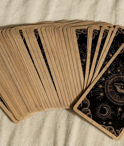 Tarot deck fanned out on linen